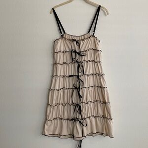Viral bow dress tan with black trim and bows